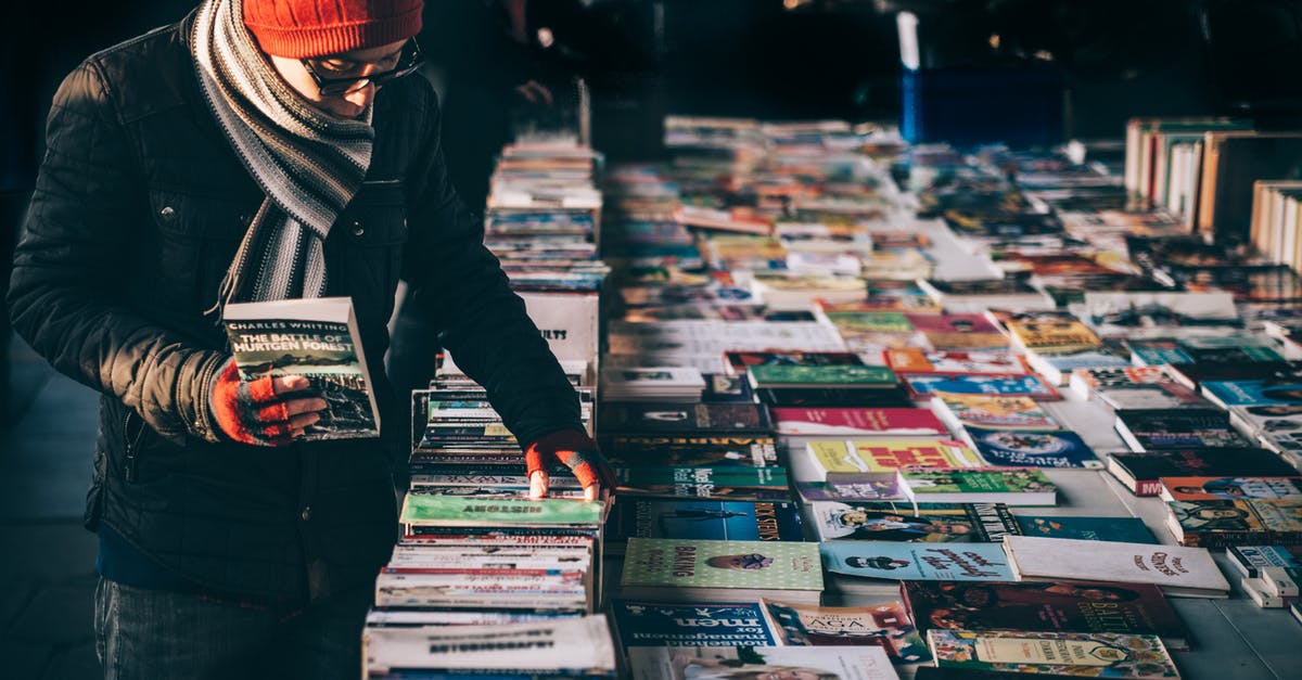 simcity nuclear meltdown even at level 4+ education - Person Holding Book While Browsing on Book Lot
