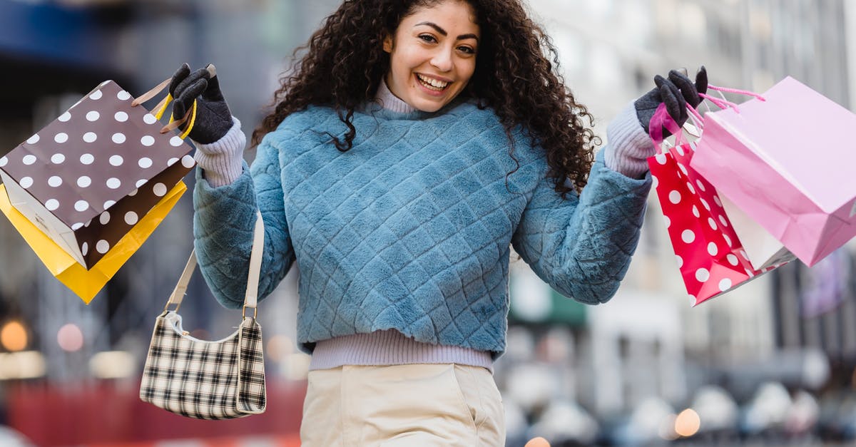 Simcity-buildit: Where do gifts appear in neighboring cities - Delighted young woman with bright gift bags after shopping Simcity-buildit: Where do gifts appear in neighboring cities - Delighted young woman with bright gift bags after shopping