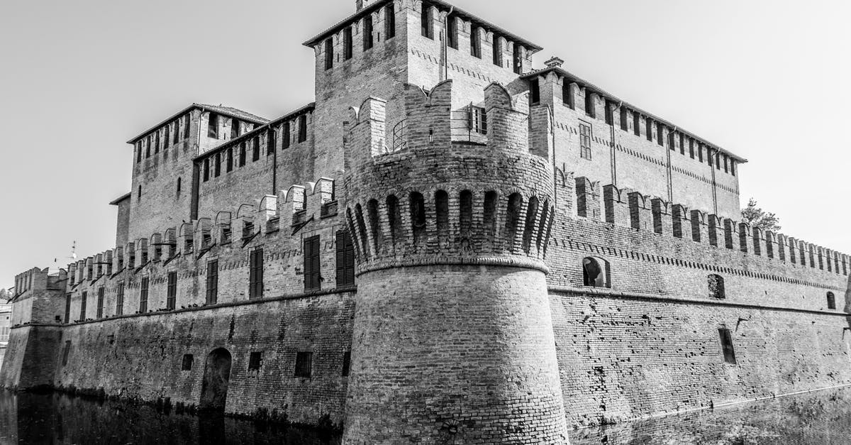 Sims Medieval refuses to open - Grayscale Photo of Concrete Building