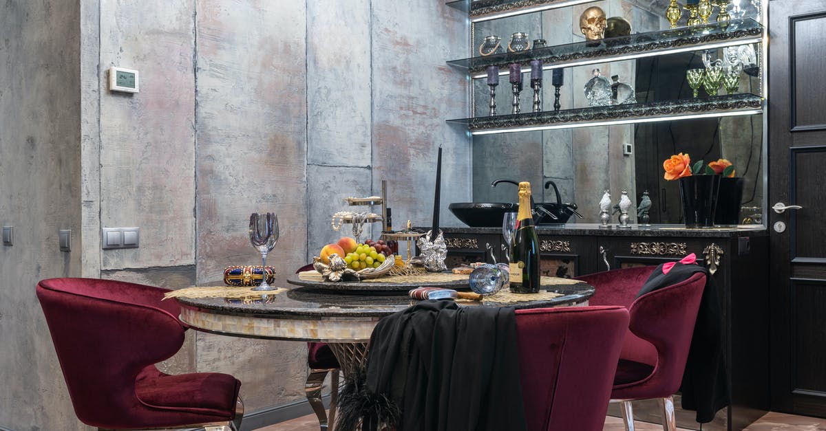 Skull Collecting - Dining room interior with furniture under shiny chandelier