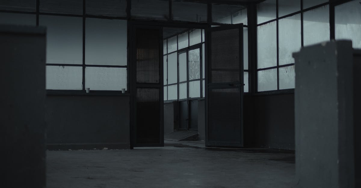 Skyrim - How to remain neutral on Thirsk Mead Hall quest - Interior of spacious empty room of gloomy abandoned building with glass windows and opened door