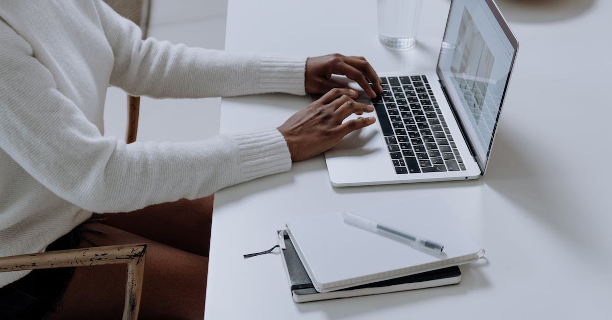Skyrim Input not working - Person in White Long Sleeve Shirt Using Macbook Pro
