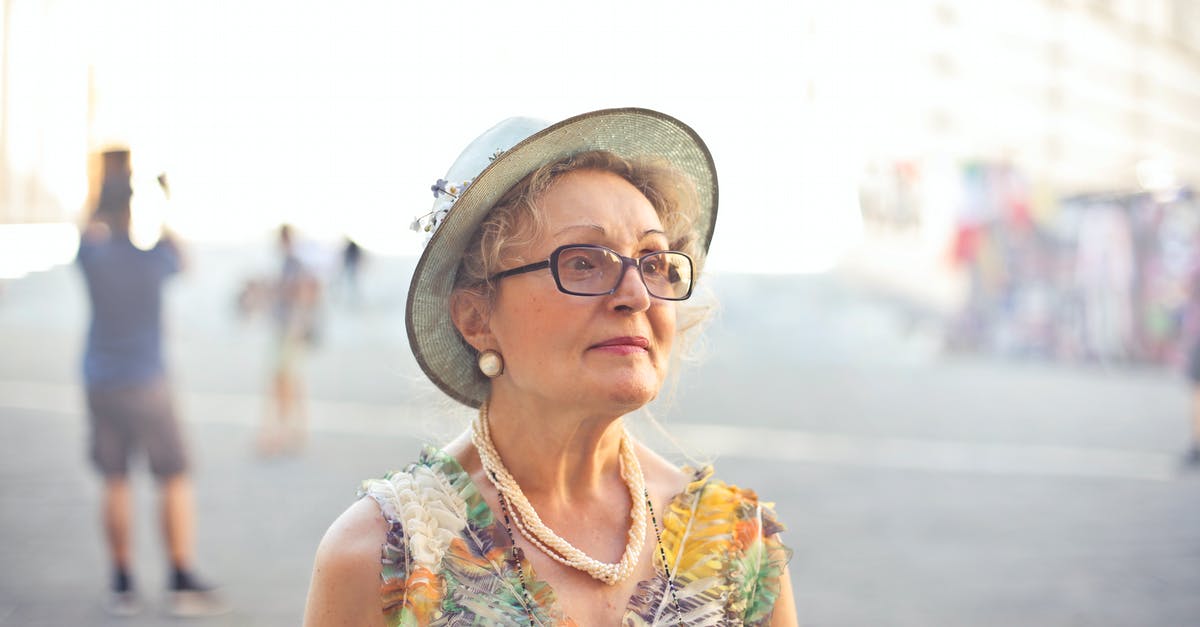 Skyrim Script Extender SKSE looks up for old Skyrim - Depth of Field Photography of Woman in Pastel Color Sleeveless Shirt and White Sunhat