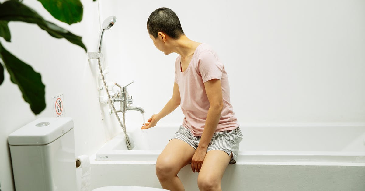 Slaves won't fill moats in stronghold - Faceless lady sitting and pouring water in bath