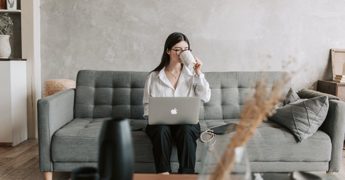 Smart! Mod for Satisfactory preventing splitter from being placed - Woman Drinking Coffee While Working With Laptop