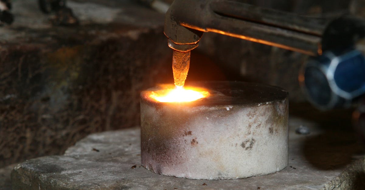 Smelting Titanium - Selective Focus Photography of Welding Torch on Concrete Round Bar Smelting Titanium - Selective Focus Photography of Welding Torch on Concrete Round Bar