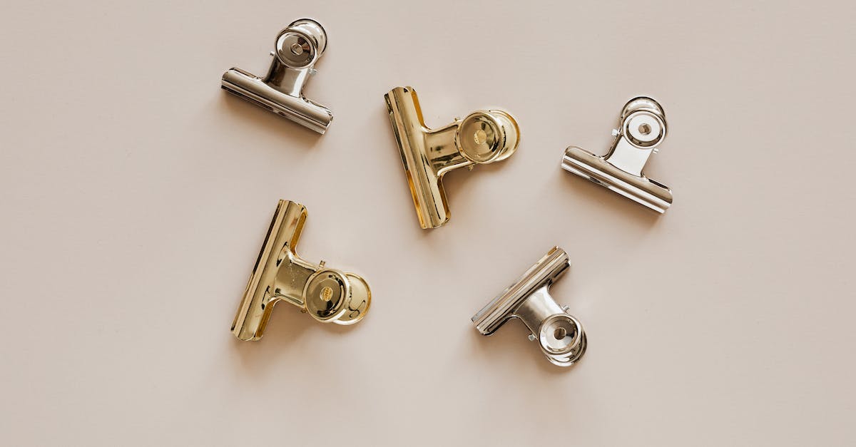 Smithing low level legendary set items - Set of metal clips on beige background