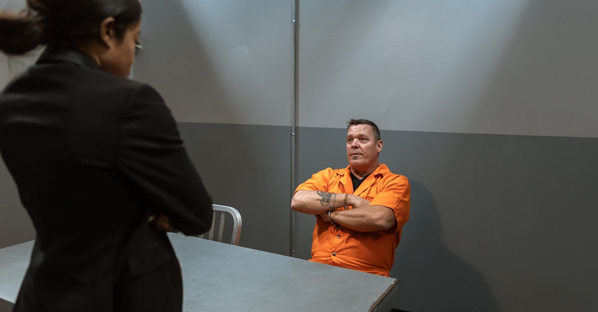 Soldiers taking out bandit camp? - Man in Orange Dress Shirt Sitting Beside Woman in Black Dress Soldiers taking out bandit camp? - Man in Orange Dress Shirt Sitting Beside Woman in Black Dress