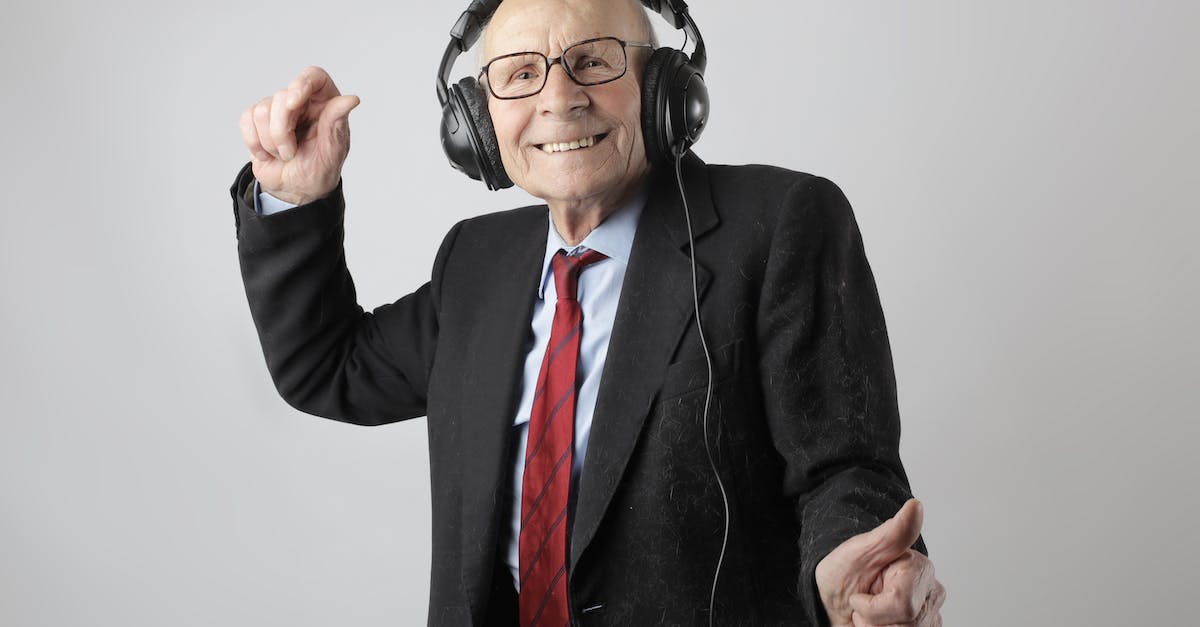 Space needed for Just Dance 2014 on PS4 - Cheerful elderly man listening to music in headphones