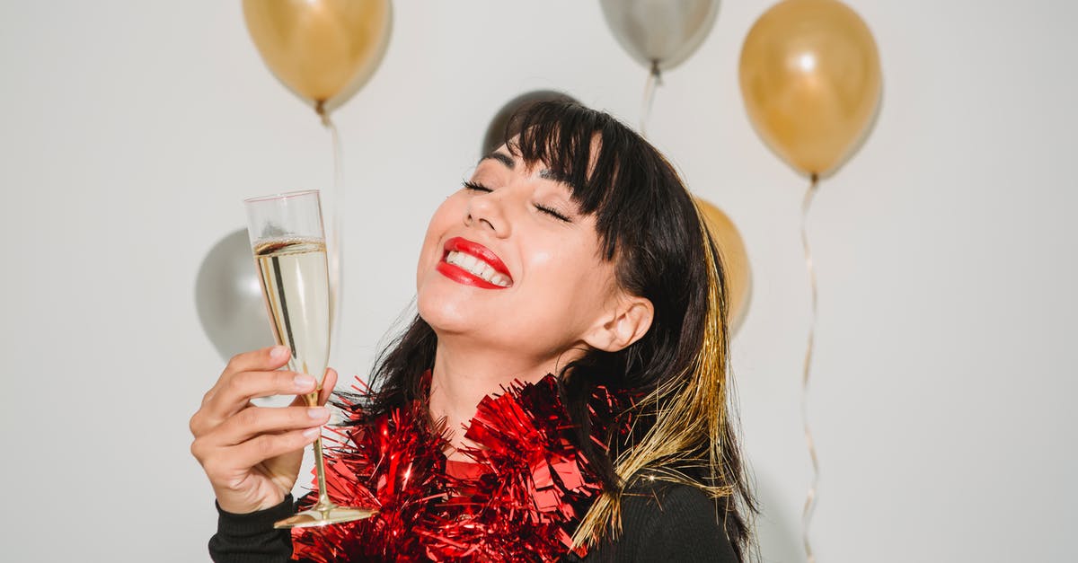 Special 8-Crown Not Appearing - Cheerful young female with closed eyes in tinsel among silver and golden balloons at special event Special 8-Crown Not Appearing - Cheerful young female with closed eyes in tinsel among silver and golden balloons at special event