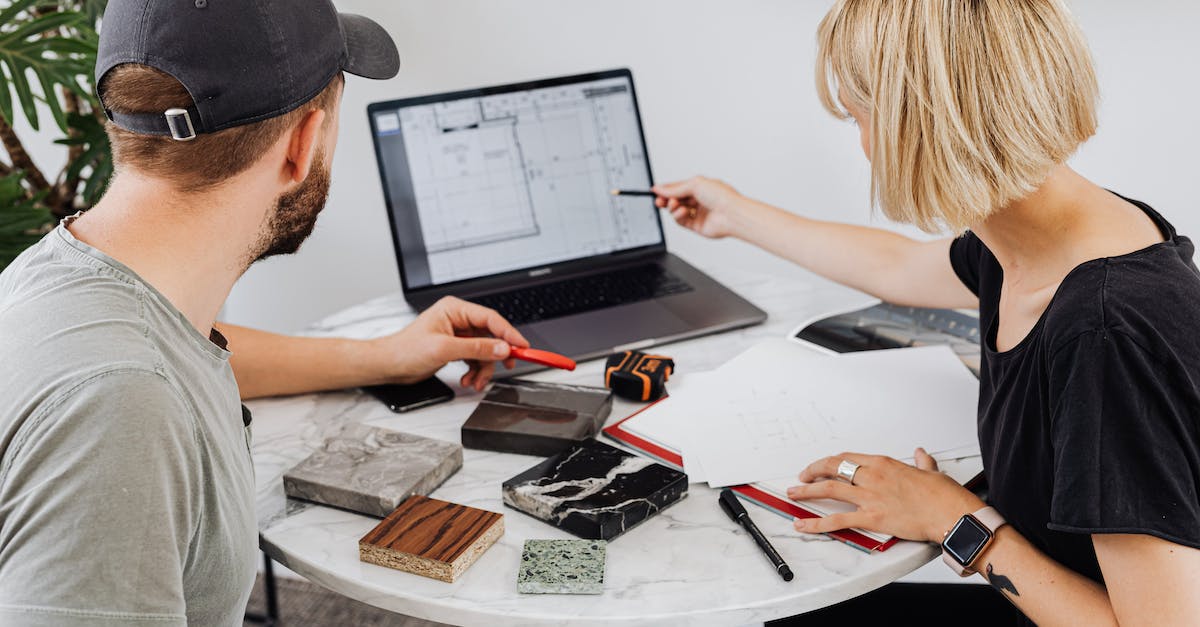 Spend soul points in ability of your own choosing - Coworkers Pointing at a Laptop and Tile Samples Spend soul points in ability of your own choosing - Coworkers Pointing at a Laptop and Tile Samples