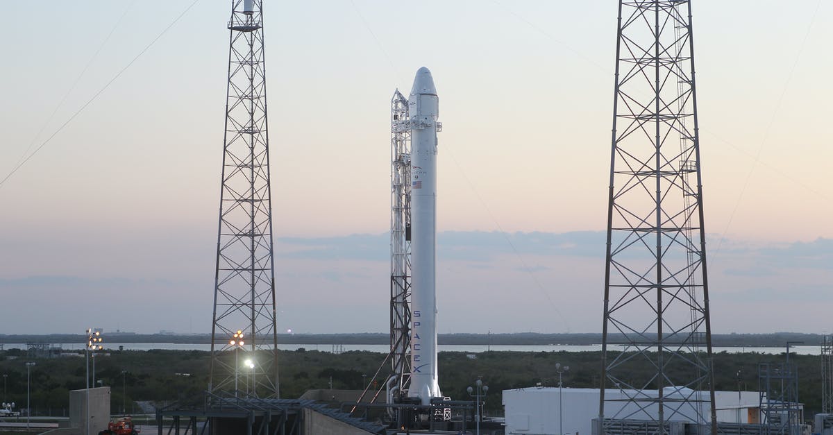 Spore space stage mission problem - Space rocket installed on metal construction in spaceport and ready for launching against cloudless sky Spore space stage mission problem - Space rocket installed on metal construction in spaceport and ready for launching against cloudless sky