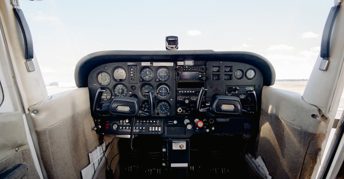 Spotting mechanics in console - Interior of cabin with dashboard consisting of steering wheel sensors and buttons for aircraft control