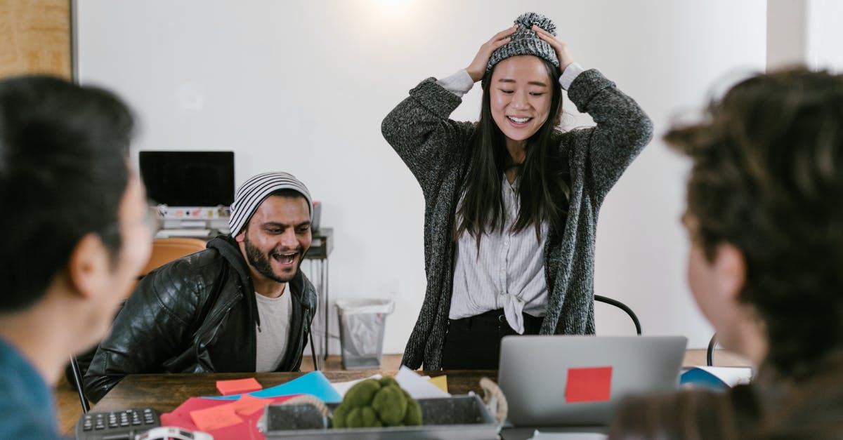 Squad overwatch reaction - Woman in Black Leather Jacket Sitting Beside Woman in Gray Scarf