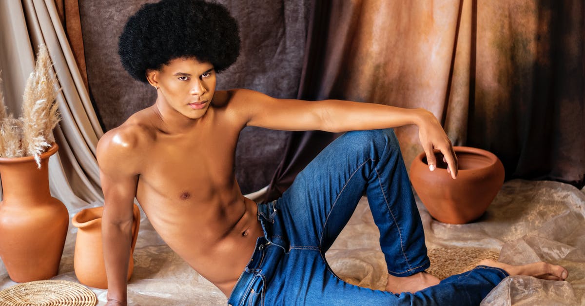 SSD in PS3 Super Slim - Portrait of a Shirtless Man with an Afro