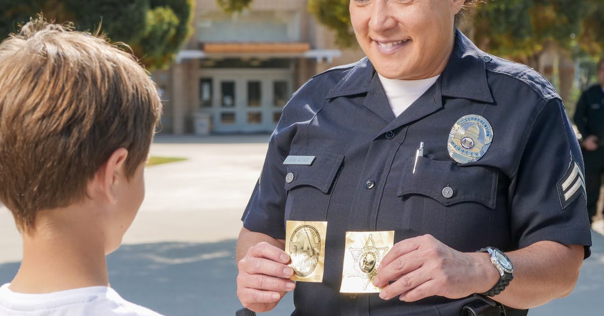 Stackable badges - 

A Policewoman Holding Stickers