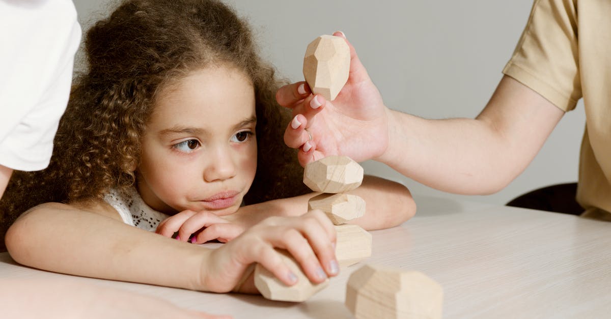 stacking up op enchantments on a sword? [duplicate] - A Young Girl Playing with Wooden Stones