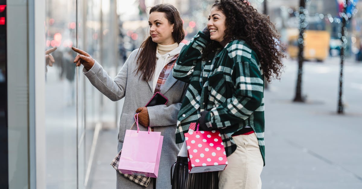 Starbattle - Whats the point of the quantum reactor for the Colossus. When is the best time to get it? - Side view of cheerful multiracial female friends with shopping bags standing on sidewalk near showcase of store on street on blurred background
