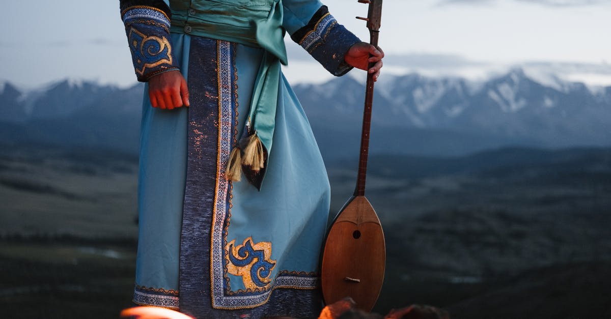 Stardew Valley : Exits appearance in mines - Crop person standing near bonfire with Mongolian folk instrument in valley Stardew Valley : Exits appearance in mines - Crop person standing near bonfire with Mongolian folk instrument in valley
