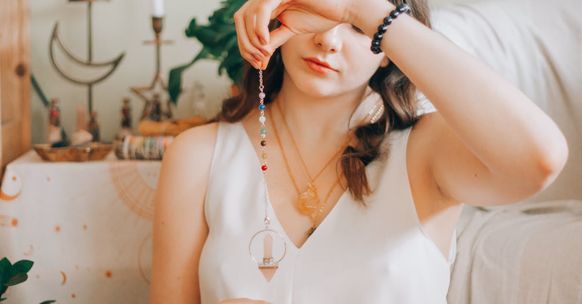 Stardew Valley Fortune Teller meaning - Woman telling fortune with silver pendant Stardew Valley Fortune Teller meaning - Woman telling fortune with silver pendant
