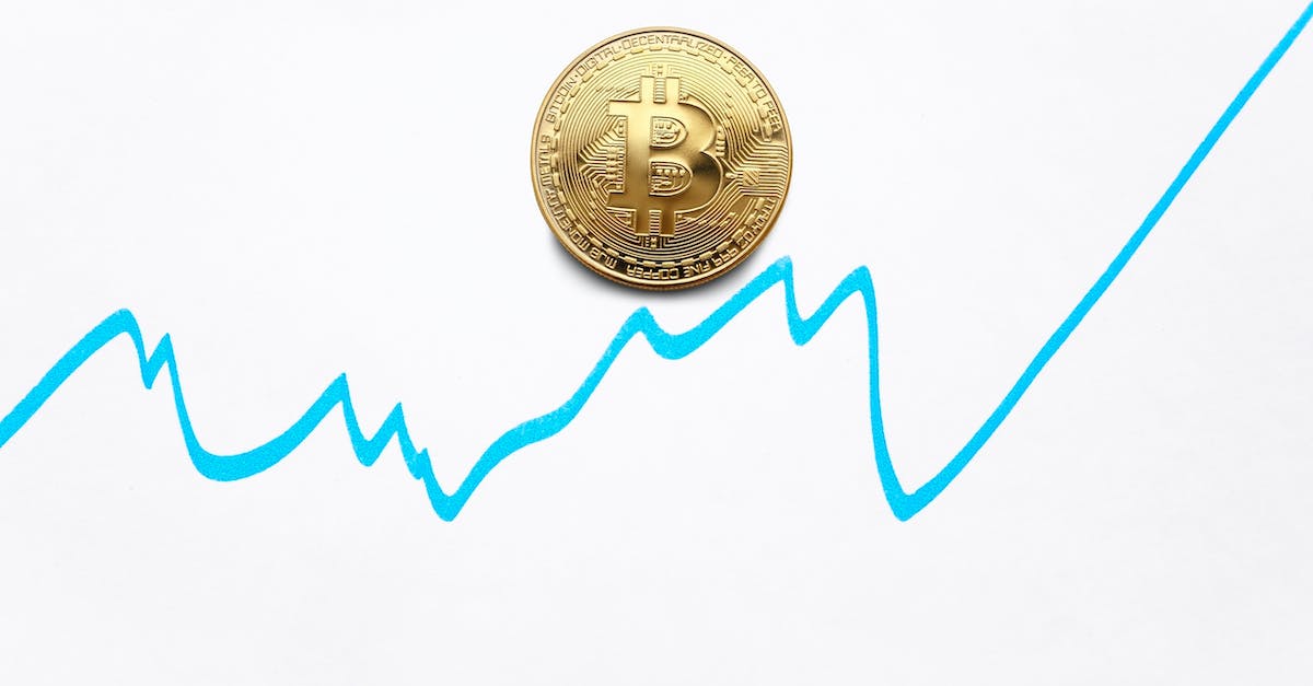 Statistics refresh rate - Gold bitcoin cryptocurrency coin and blue graph of changes of value on white background Statistics refresh rate - Gold bitcoin cryptocurrency coin and blue graph of changes of value on white background