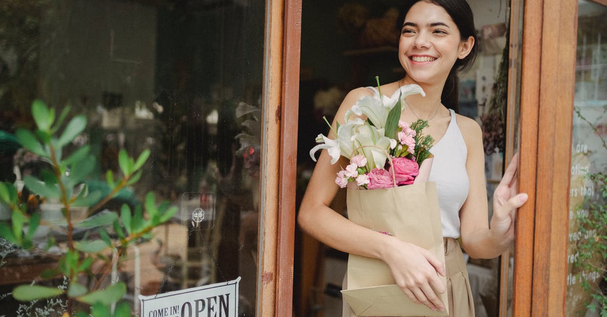 Steam Community Market - Wait Time Keeps Changing - Toothy smiling female standing near flower shop and holding paper package with bouquet
