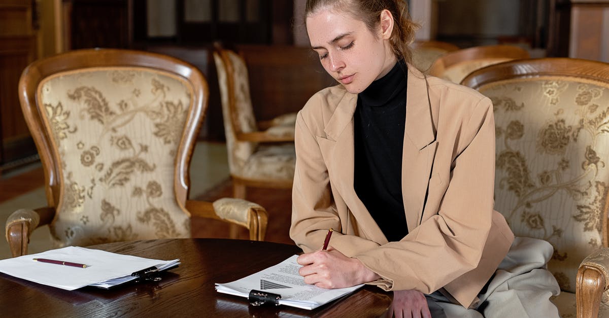 Steam Disk Write Error - Woman in Brown Blazer Sitting on Chair Steam Disk Write Error - Woman in Brown Blazer Sitting on Chair