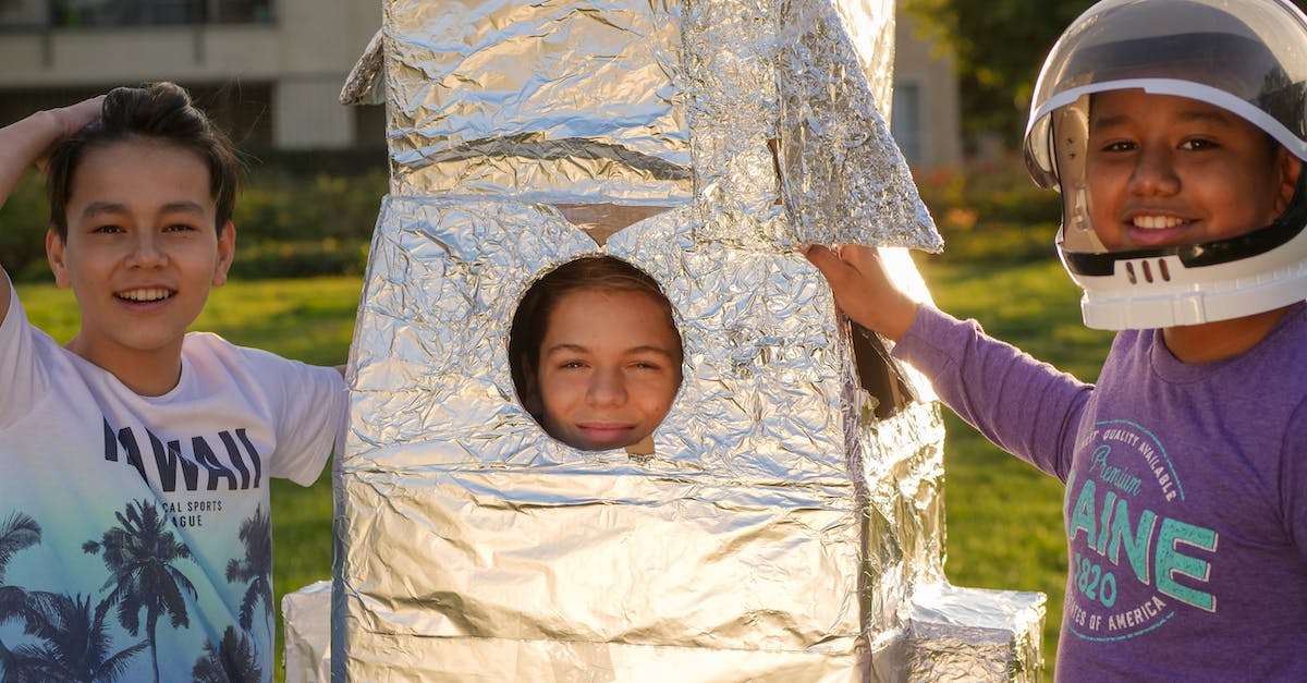 Steam launch commands: a way to launch a little script? - Girl in White Long Sleeve Shirt Holding White and Gray Floral Textile