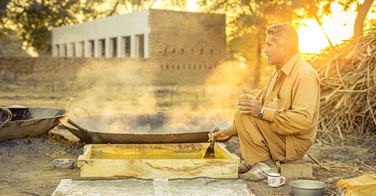 Steam stuck on startup - Man in Brown Robe Sitting on Brown Wooden Log