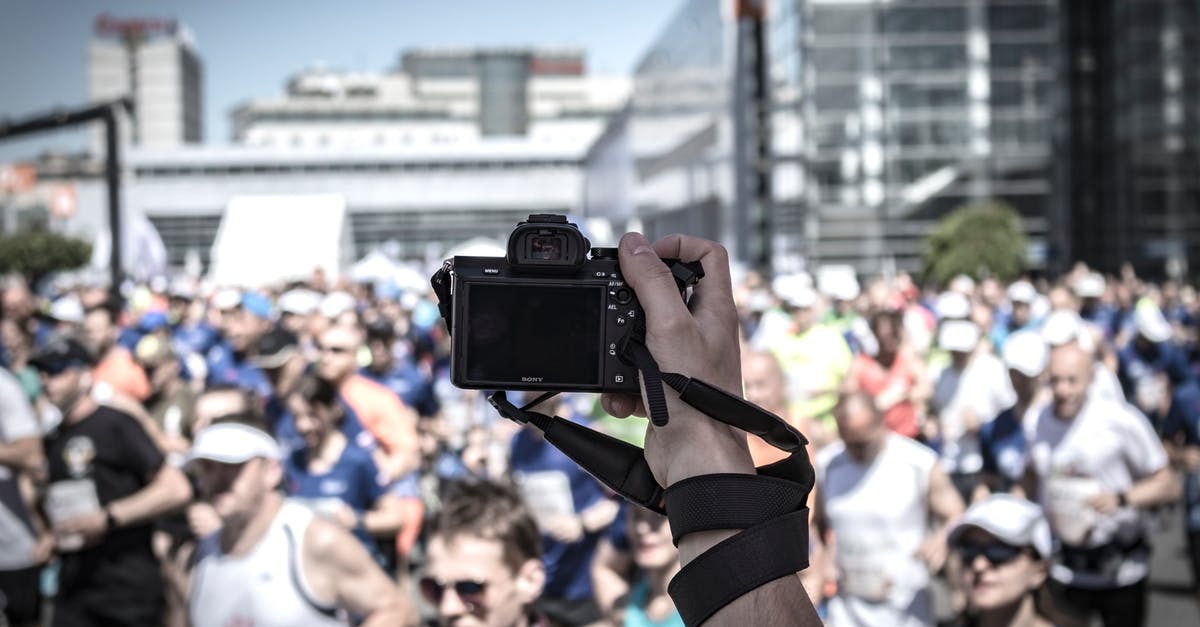 Stop Camera Rotation During Wild Battle - Person Hoding Camera Taking Photo of People Stop Camera Rotation During Wild Battle - Person Hoding Camera Taking Photo of People