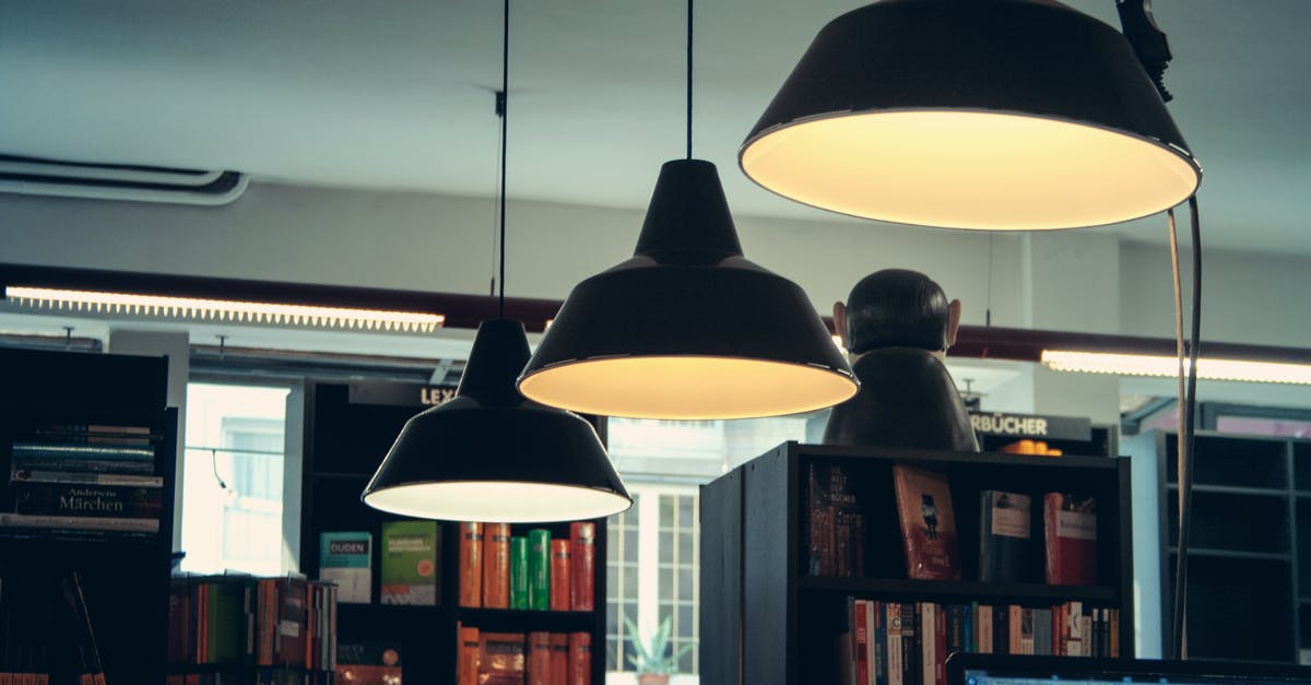 Storing books in the Arcaneum library - Illuminated Grey Pendant Lamps Storing books in the Arcaneum library - Illuminated Grey Pendant Lamps