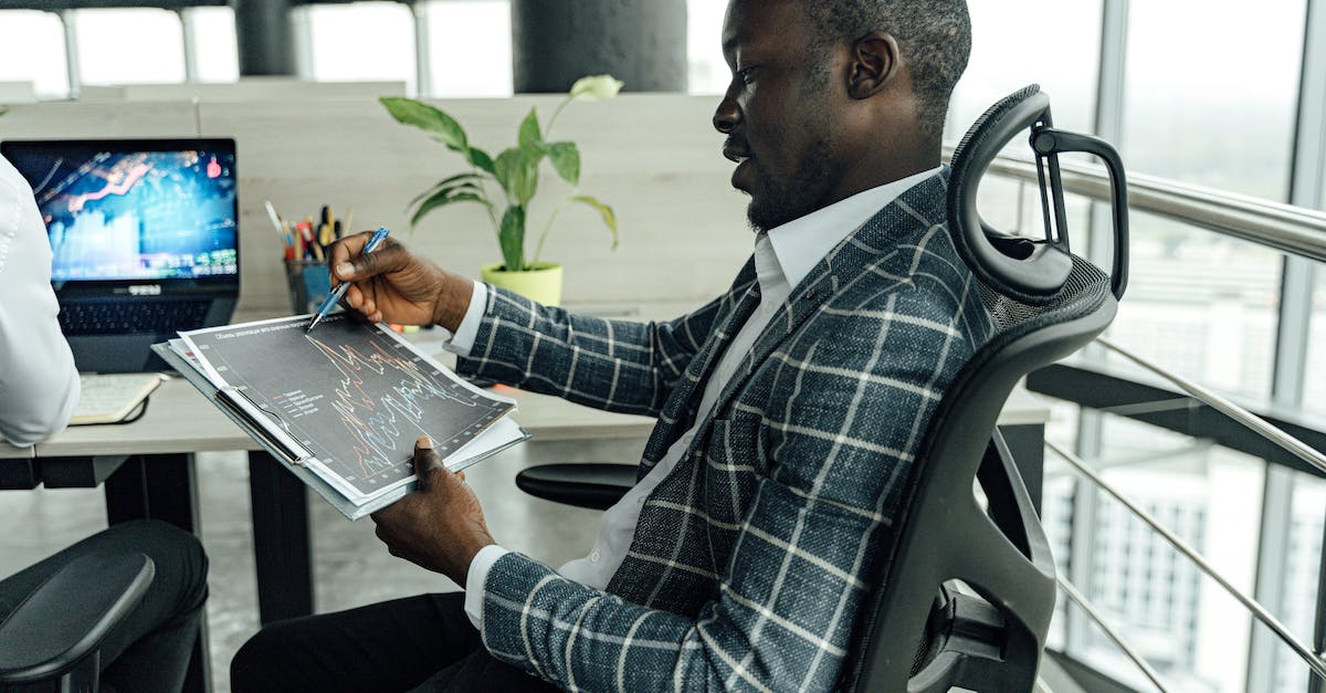 Strange Boss around Level 110 - Professional Business Man looking at Charts Strange Boss around Level 110 - Professional Business Man looking at Charts