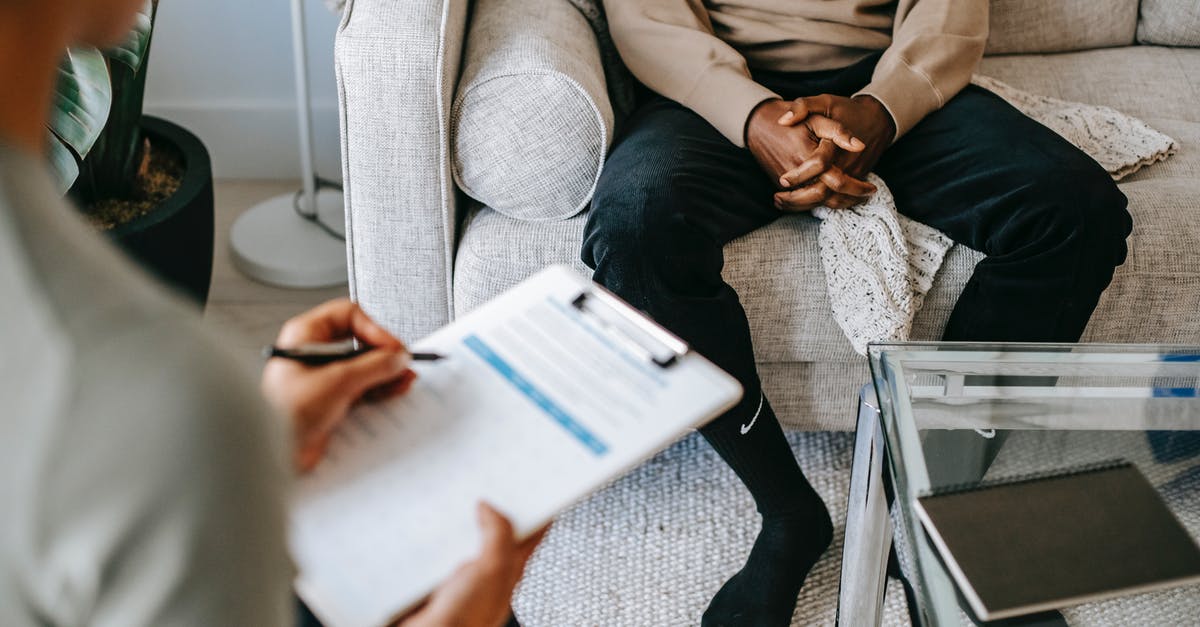 Strange issue with ping - Crop ethnic client discussing problems with anonymous psychologist Strange issue with ping - Crop ethnic client discussing problems with anonymous psychologist