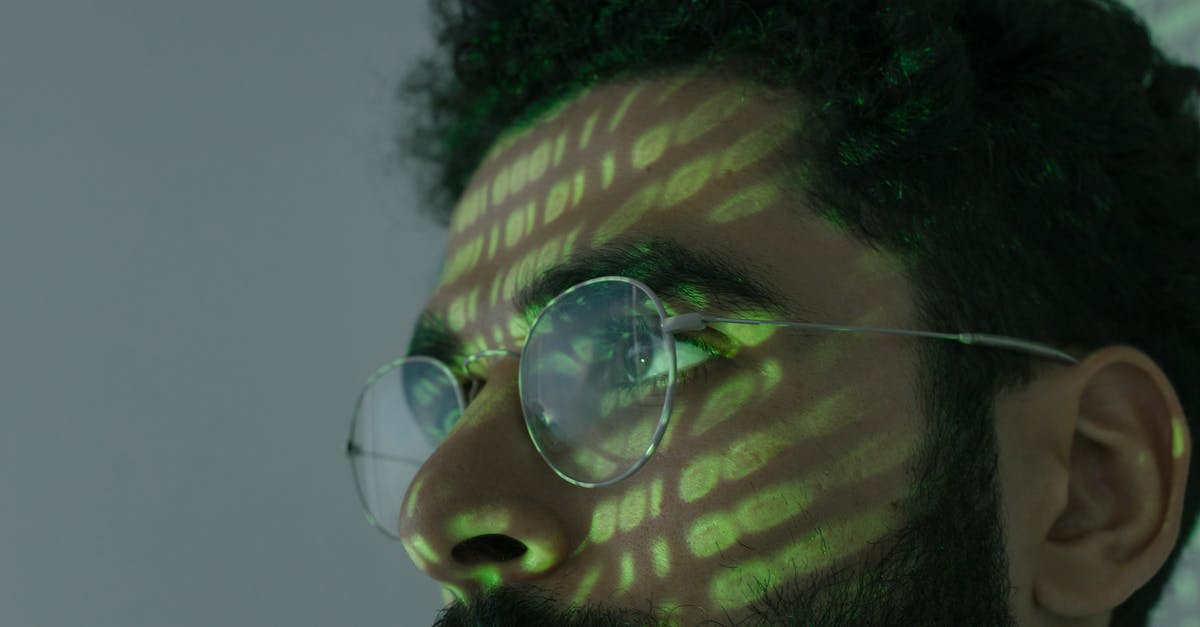 Strange lighting anomaly - Man Wearing Silver Framed Eyeglasses Strange lighting anomaly - Man Wearing Silver Framed Eyeglasses