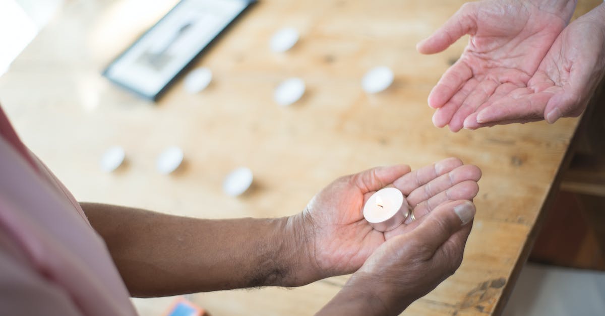 Stuck with Only a Candle to my Name - Person Holding White Round Medication Pill Stuck with Only a Candle to my Name - Person Holding White Round Medication Pill