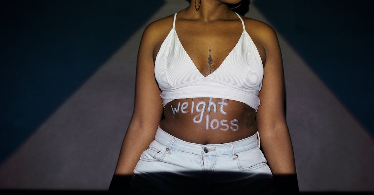 Stuck with the "S"-Bug in the LeChuck Text in level 12 - Close-Up Photo of a Person Showing Weight Loss Written on Tummy 