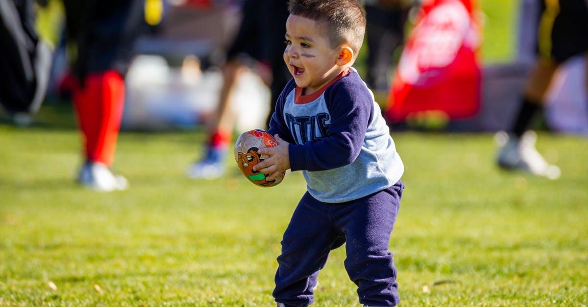 Succeed in baby rocking game in Tomodachi? - Boy in Purple Long Sleeves Shirt and Purple Pants Holding Brown Football Succeed in baby rocking game in Tomodachi? - Boy in Purple Long Sleeves Shirt and Purple Pants Holding Brown Football