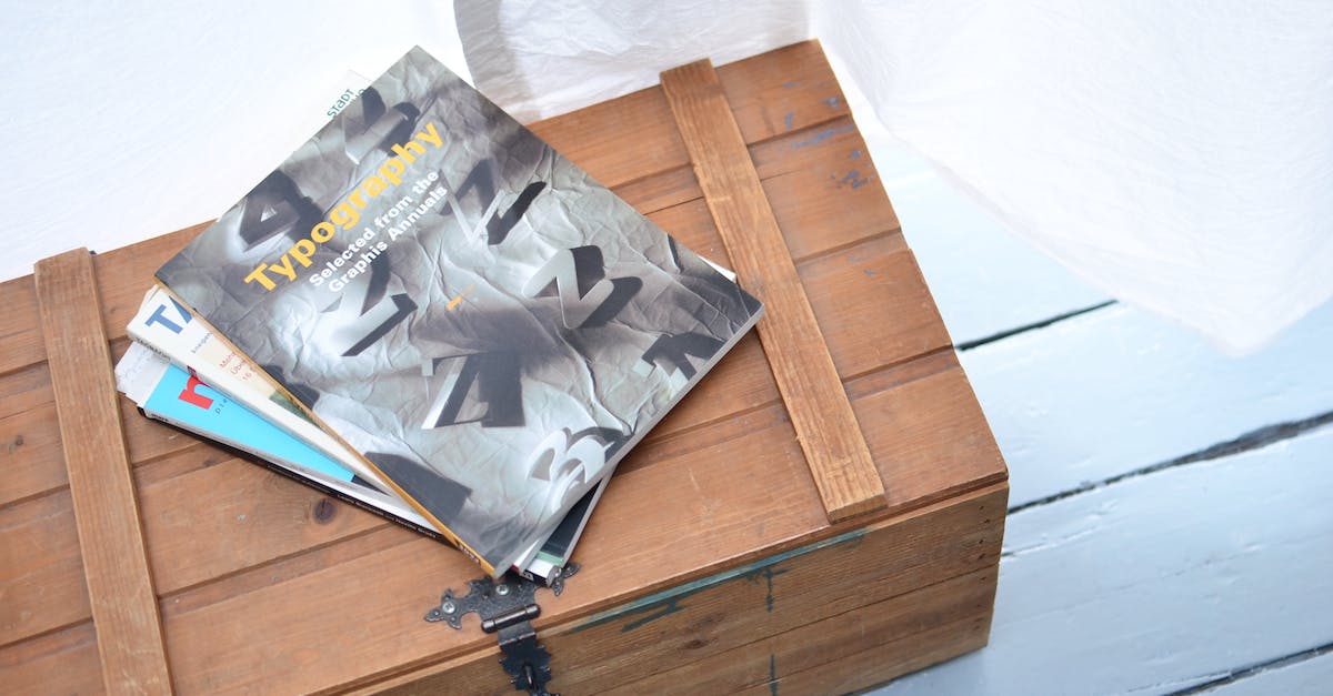 Super Crate Box keeps crashing - From above of various colorful journals placed on top of low vintage wooden box near white curtain in light room Super Crate Box keeps crashing - From above of various colorful journals placed on top of low vintage wooden box near white curtain in light room