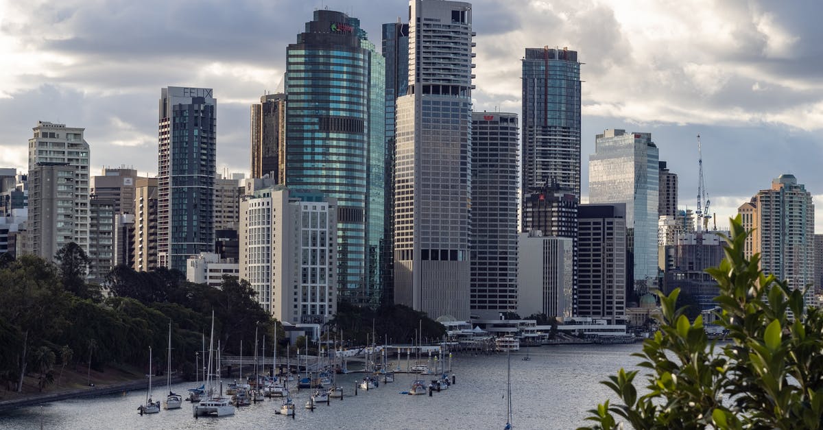 T7-01 not there? - White and Brown High Rise Buildings Near Green Palm Trees