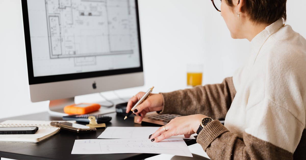 Taking missions from the same agent - Crop estate agent working with computer in office