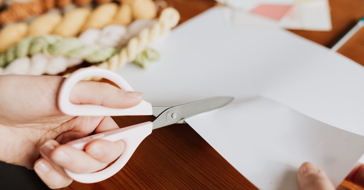 Target Self Key - how can I make it work? - Crop young woman cutting paper sheet on wooden table Target Self Key - how can I make it work? - Crop young woman cutting paper sheet on wooden table