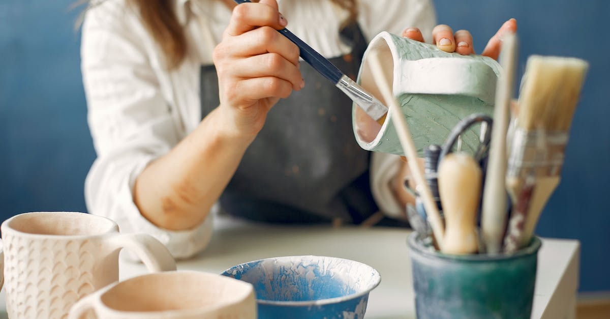 Target Self Key - how can I make it work? - Crop anonymous craftswoman in apron painting handmade ceramic products while working in contemporary creative pottery Target Self Key - how can I make it work? - Crop anonymous craftswoman in apron painting handmade ceramic products while working in contemporary creative pottery