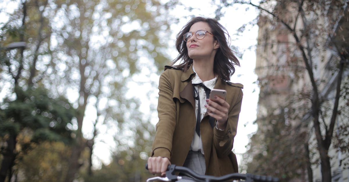 Tech tree for buildings and units - Woman in Brown Coat Riding Bicycle During Daytime Tech tree for buildings and units - Woman in Brown Coat Riding Bicycle During Daytime
