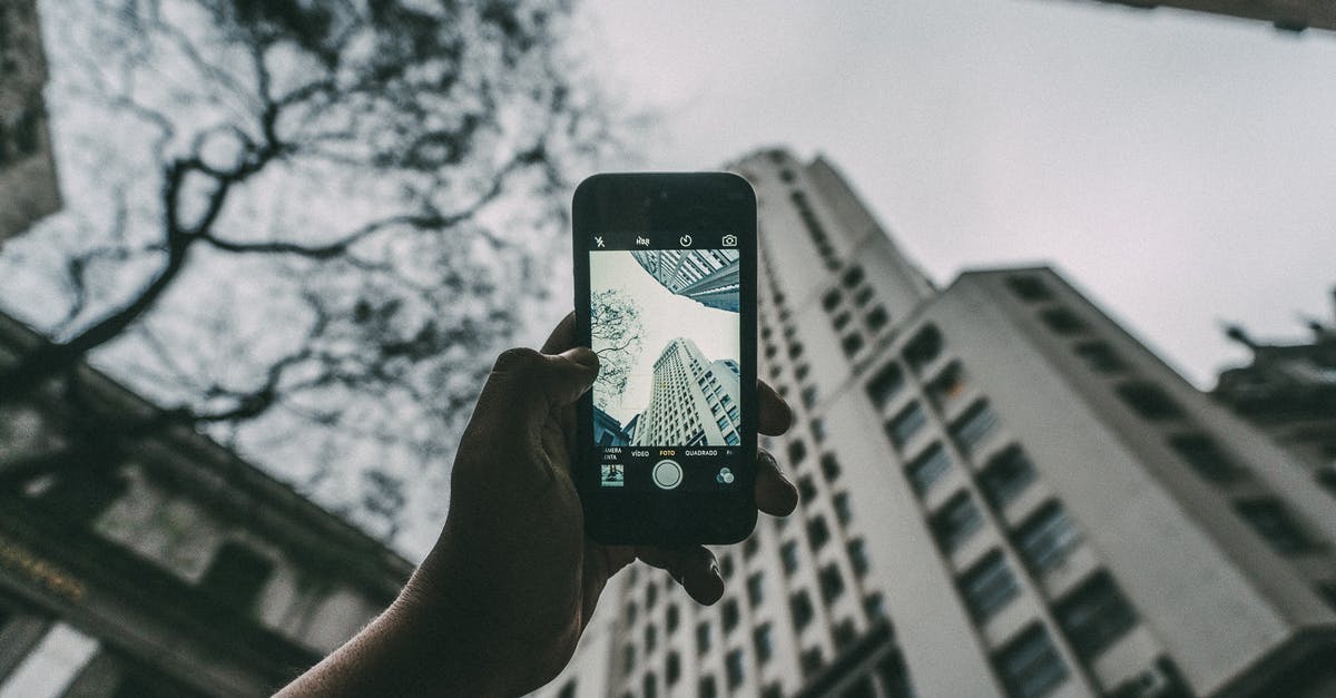 Tech tree for buildings and units - Person Holding Iphone Near Building Tech tree for buildings and units - Person Holding Iphone Near Building