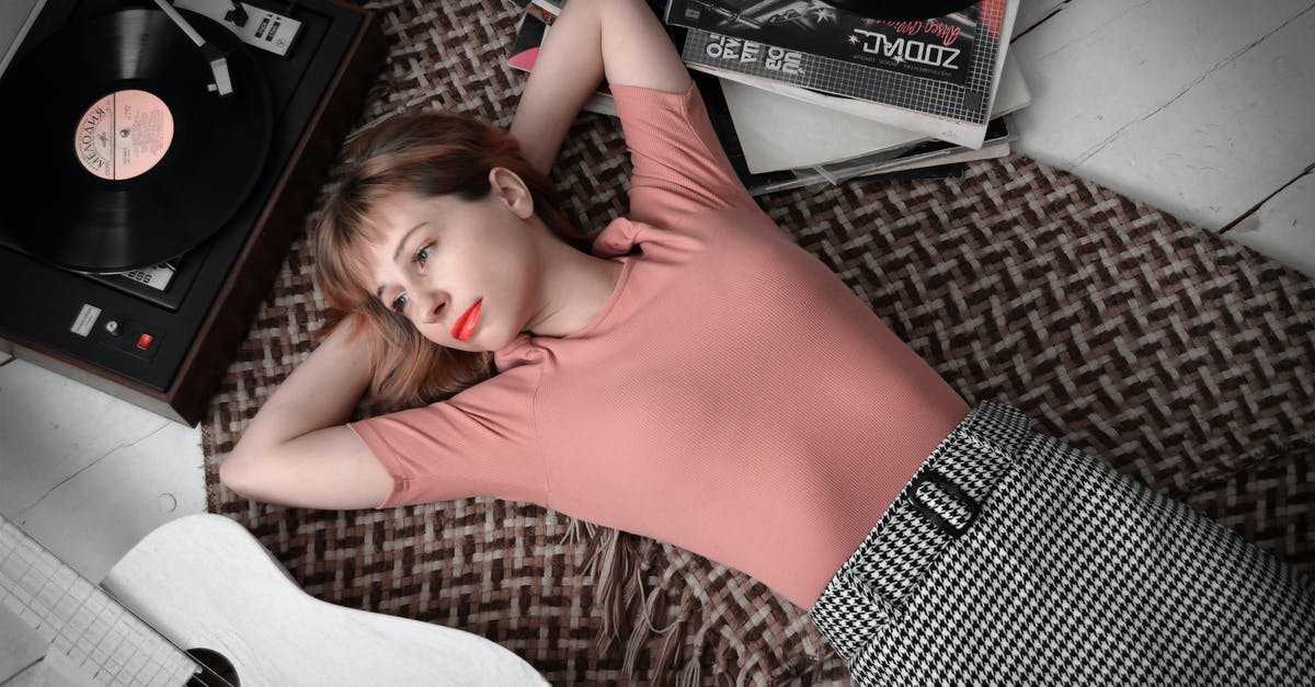Teleport a player away from certain entities? - Dreamy woman lying on floor near vinyl record player