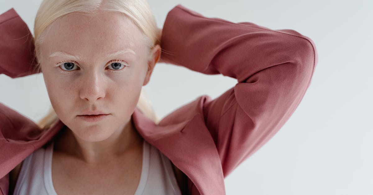 Teleport an armorstand facing another armorstand with pitch (head rotation) - Woman in White Crew Neck Shirt and Pink Blazer