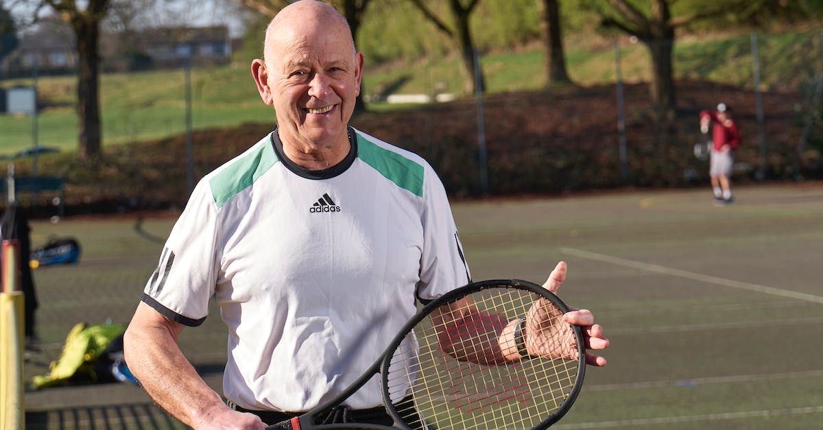 Test if player is holding something but the specified item [duplicate] - Man in White Nike Crew Neck T-shirt Holding Black and Red Tennis Racket