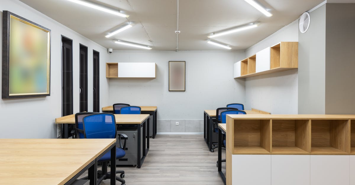 /testfor finding item in item frame help? - Interior of contemporary workspace with office chairs at tables and wooden shelves under ceiling with geometric lamps /testfor finding item in item frame help? - Interior of contemporary workspace with office chairs at tables and wooden shelves under ceiling with geometric lamps
