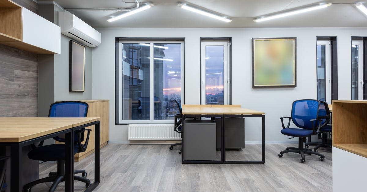 /testfor finding item in item frame help? - Interior of cotemporary office with wooden tables and chairs illuminated by ceiling lamps /testfor finding item in item frame help? - Interior of cotemporary office with wooden tables and chairs illuminated by ceiling lamps