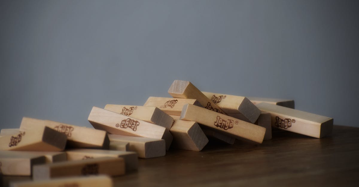 Testfor multiple dropped items - Set of small wooden blocks scattered on table chaotically after playing tower game Testfor multiple dropped items - Set of small wooden blocks scattered on table chaotically after playing tower game